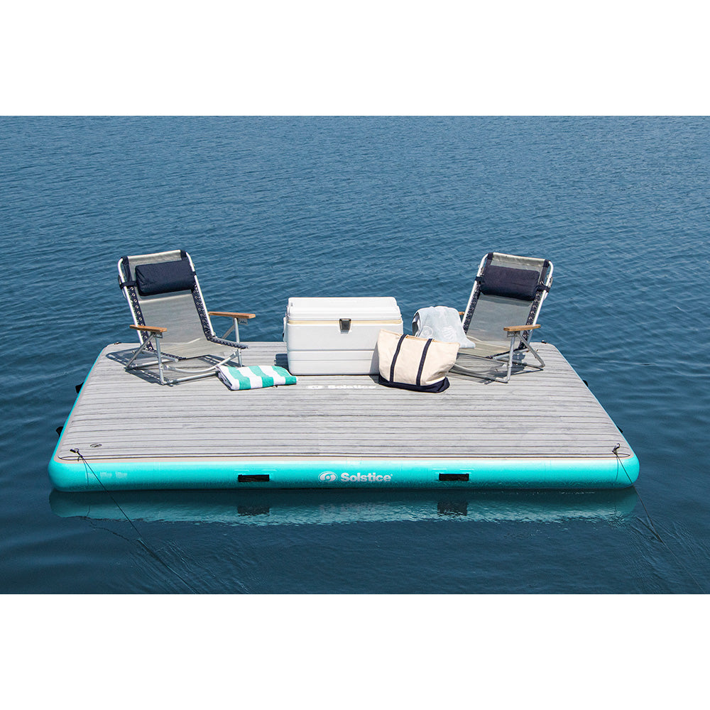 “Solstice inflatable dock with teal edge for lounging, swimming, and water activities”