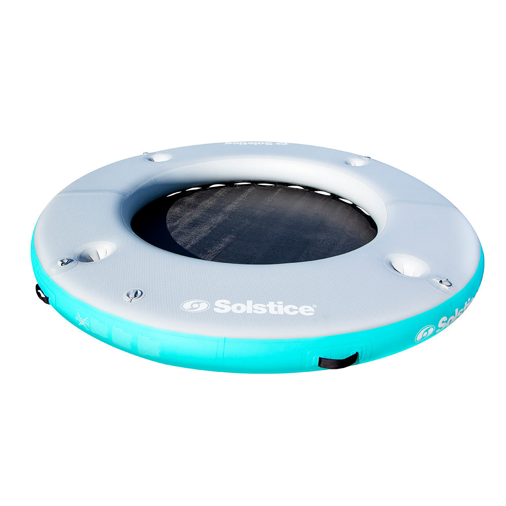 “Solstice inflatable floating lounge with swim center hole and people relaxing on turquoise water”