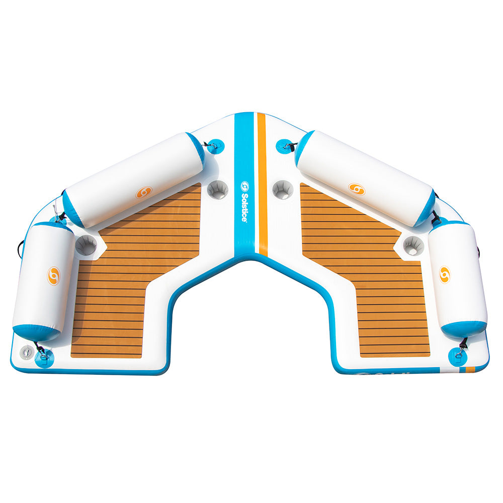 Solstice inflatable dock platform with V-shaped cutout and side bolster floats for boats and watercraft docking.”